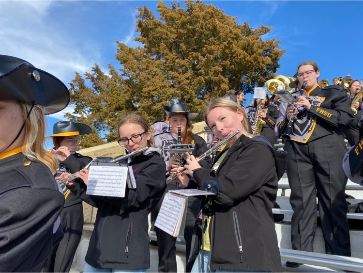 Haley and Serinity playing flute with the FHSU band