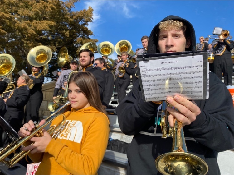 Daynah and Gabriel playing trumpet with the FHSU band