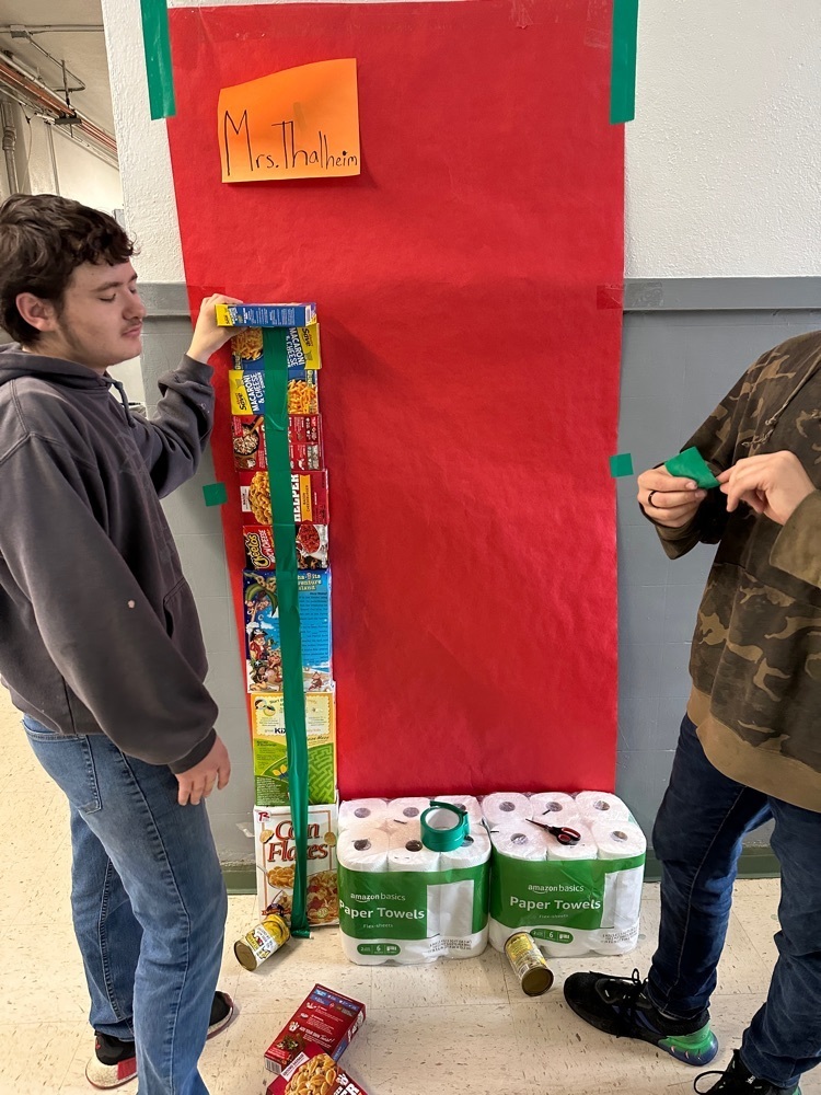 students stacking donations for the food pantry